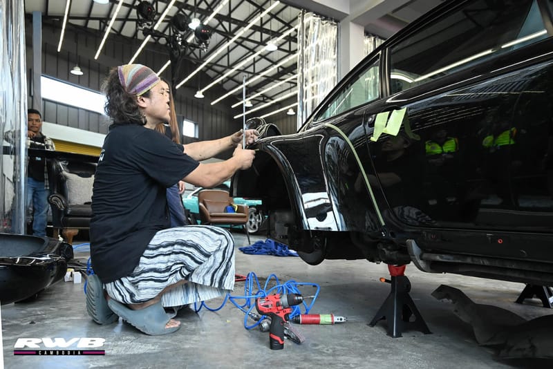 Nakai working on door panel
